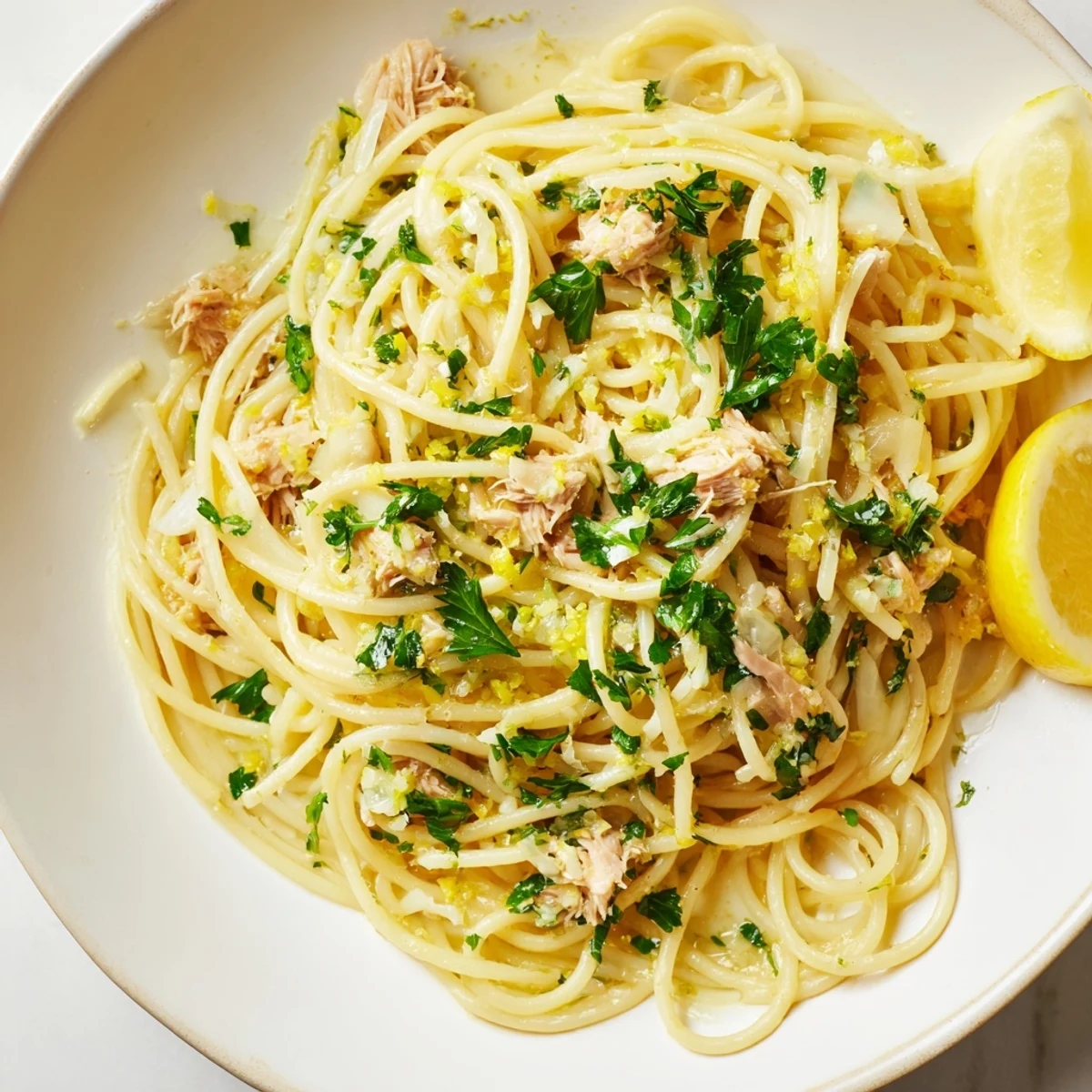 Steaming Lemon-Garlic Tuna Spaghetti, a flavorful pasta dish with flaky tuna and bright lemon.