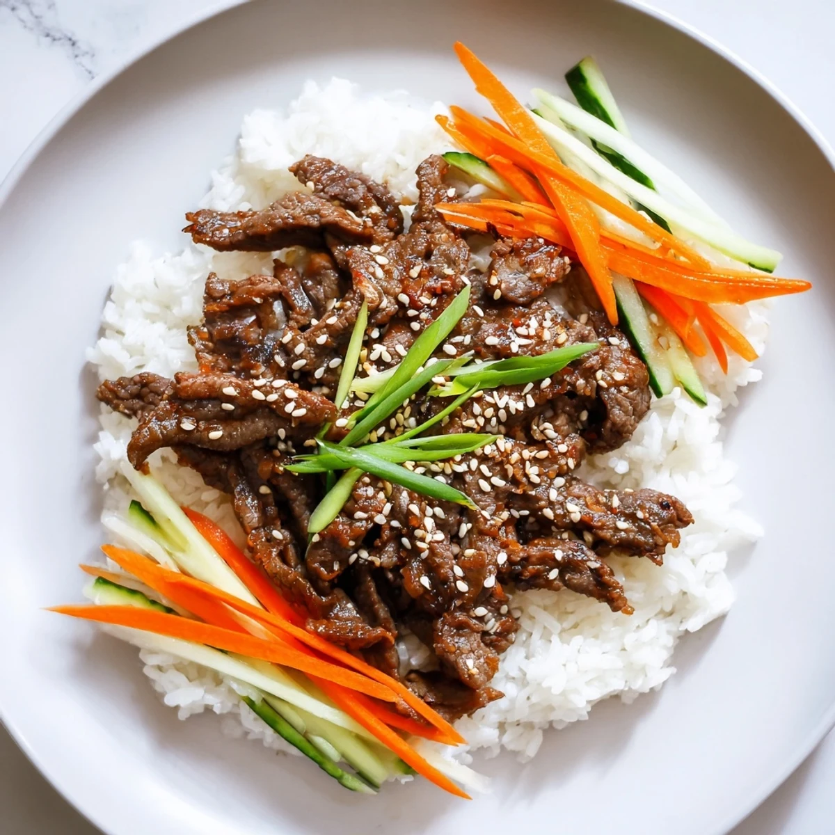 Tender bulgogi beef bowl with glistening marinated beef and colorful, crisp vegetables piled high.