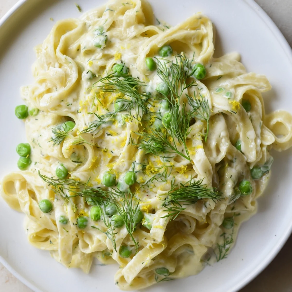 Enjoy a steaming bowl of creamy dill pasta, a perfect vegetarian meal with lemon and dill.