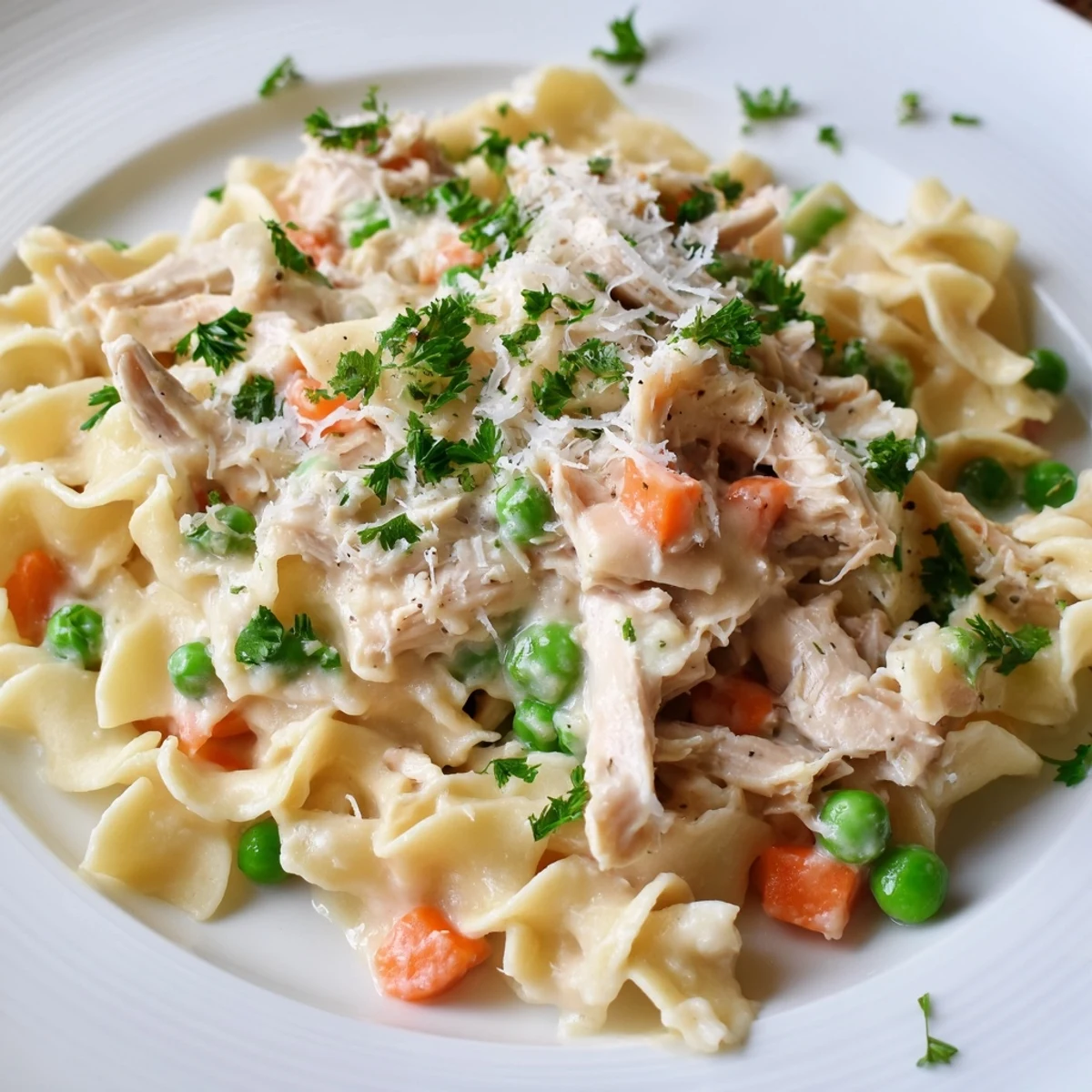 Family-style Spring Chicken Noodle Skillet in a rustic skillet, garnished with fresh parsley and ready to serve with crusty bread.