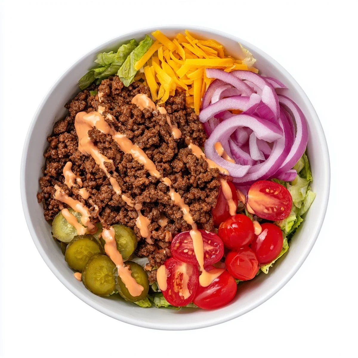 A close-up view of an Easy Big Mac in a Bowl with seasoned ground beef, fresh lettuce, and a creamy, tangy sauce.  