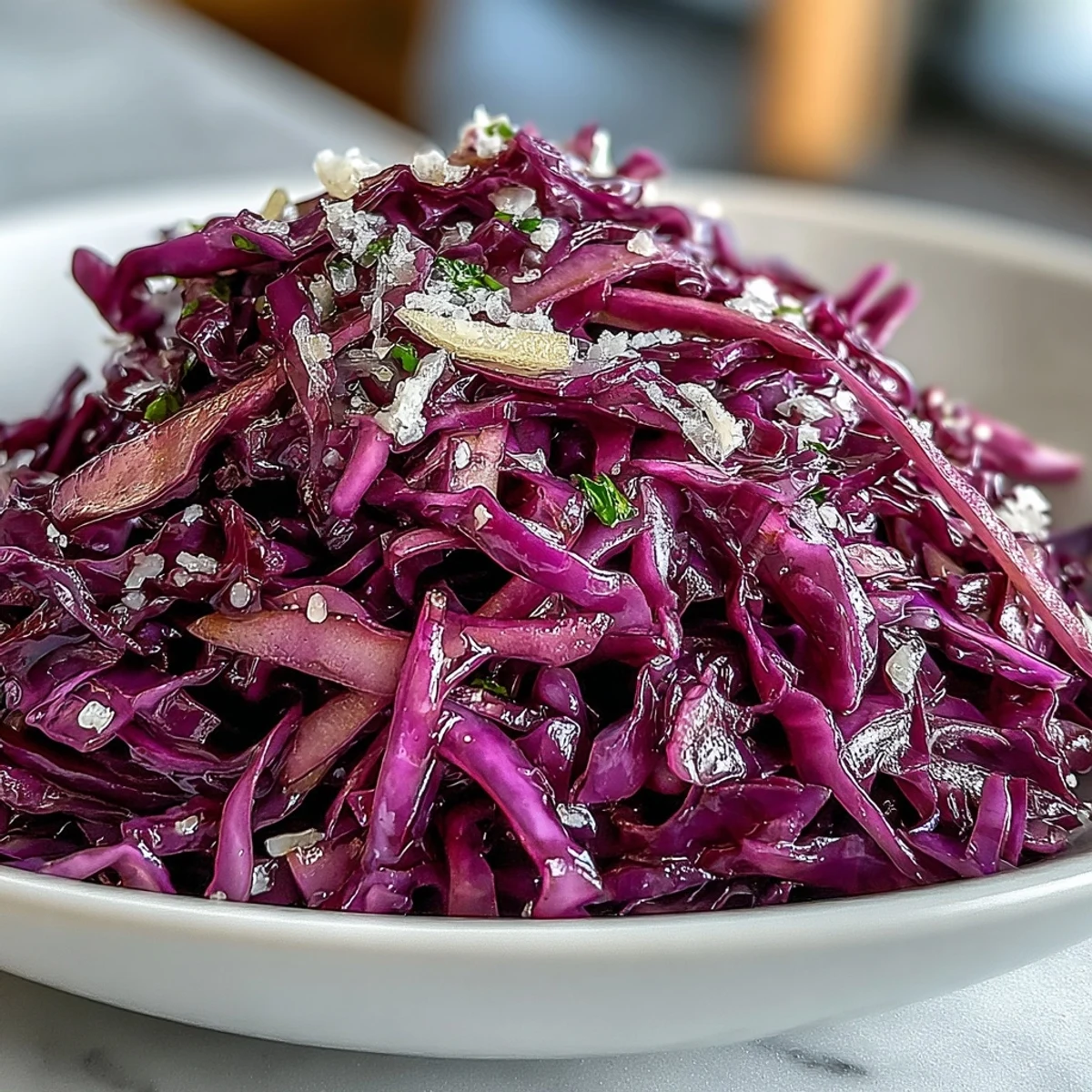 Bright purple Red Cabbage Coleslaw With Apple and Parmesan features crisp shreds and tangy vinaigrette.