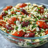 Crumbled feta crowns this summery orzo salad, a refreshing side dish.