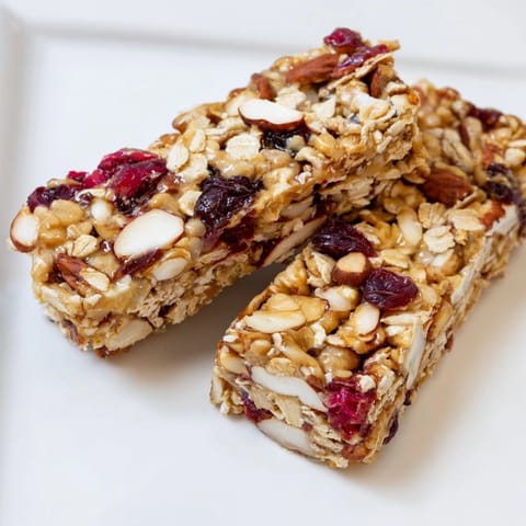 Golden, chewy No-Bake Energy Bars studded with nuts and fruit, perfect for a quick breakfast.