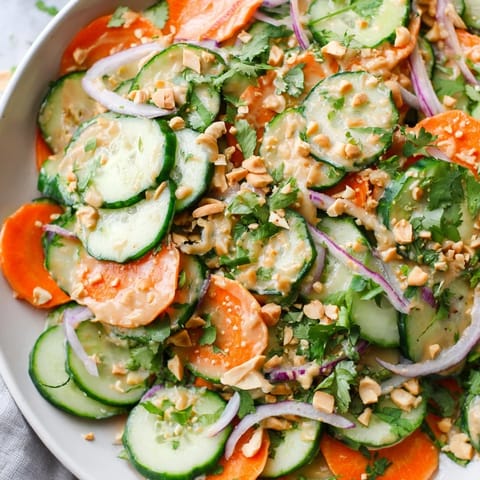 Fresh, crunchy Thai-Style Peanut Cucumber Salad with colorful vegetables, perfect for a light lunch.