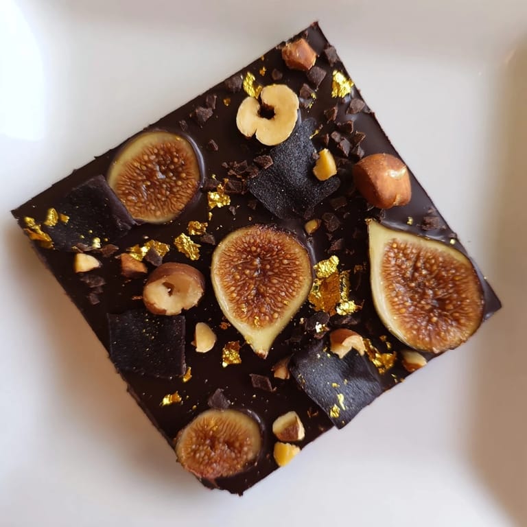 A top-down view of the Midnight Mosaic: showing a beautiful, layered dessert with dark chocolate base.