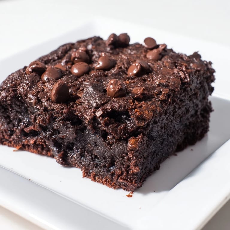 Indulge in these rich and tender Greek yogurt brownies, perfectly baked with a moist, delicious crumb.