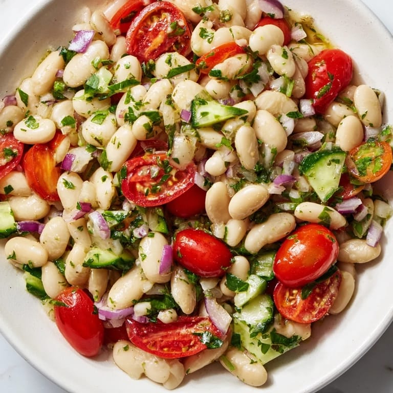 Close-up of a rustic white bean salad; imagine the flavors of the Mediterranean at your table.