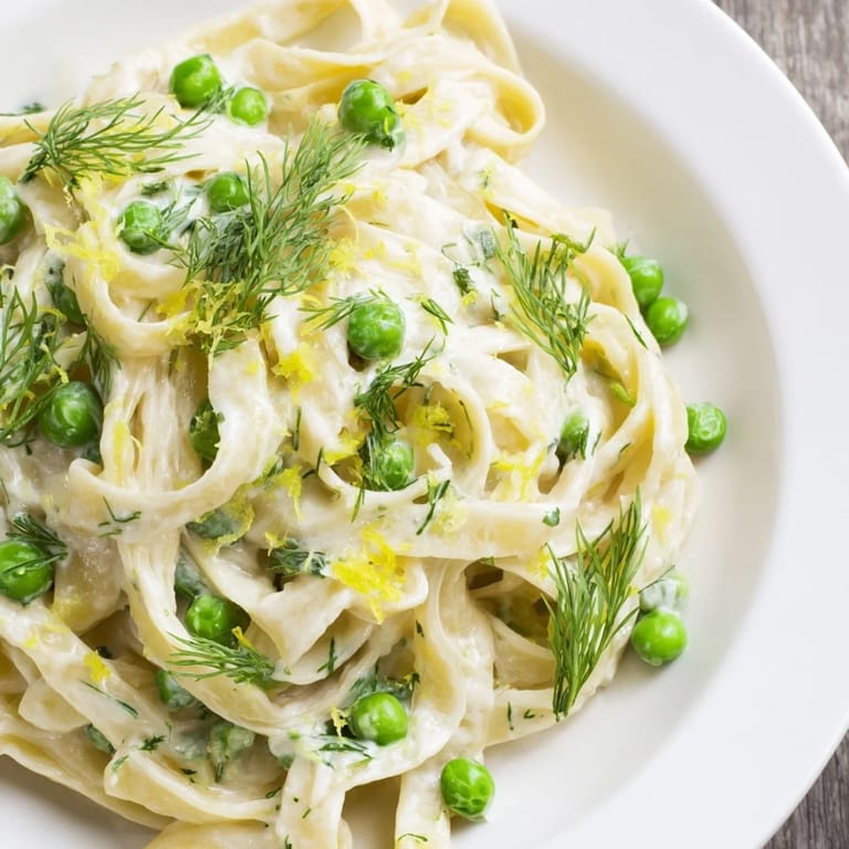 This delicious creamy dill pasta features ribbons of pasta with a bright, vibrant dill garnish.