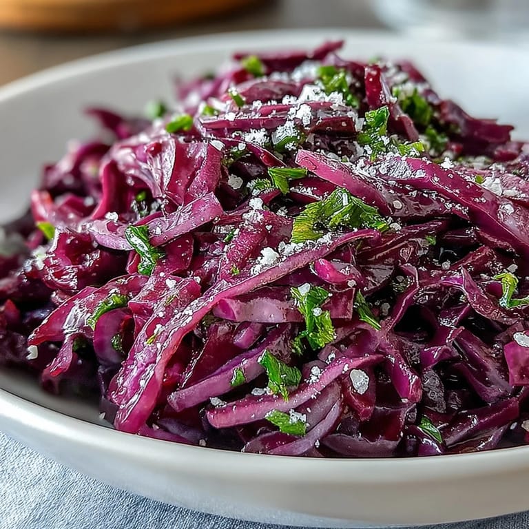 Vibrant Red Cabbage Coleslaw With Apple and Parmesan served as a refreshing, gluten-free vegetarian side salad.