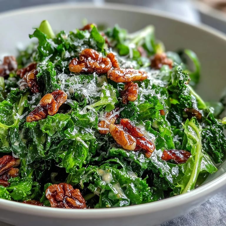 Arugula salad with lemon vinaigrette, Parmesan shavings, and pine nuts, served as a light, zesty side dish.