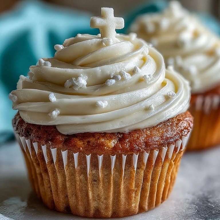 Celebrate with these visually stunning communion cupcakes, featuring buttercream and a fondant cross topper.